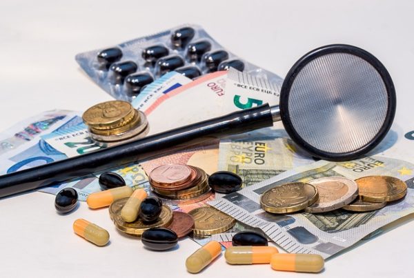 Pills, stethoscope and money